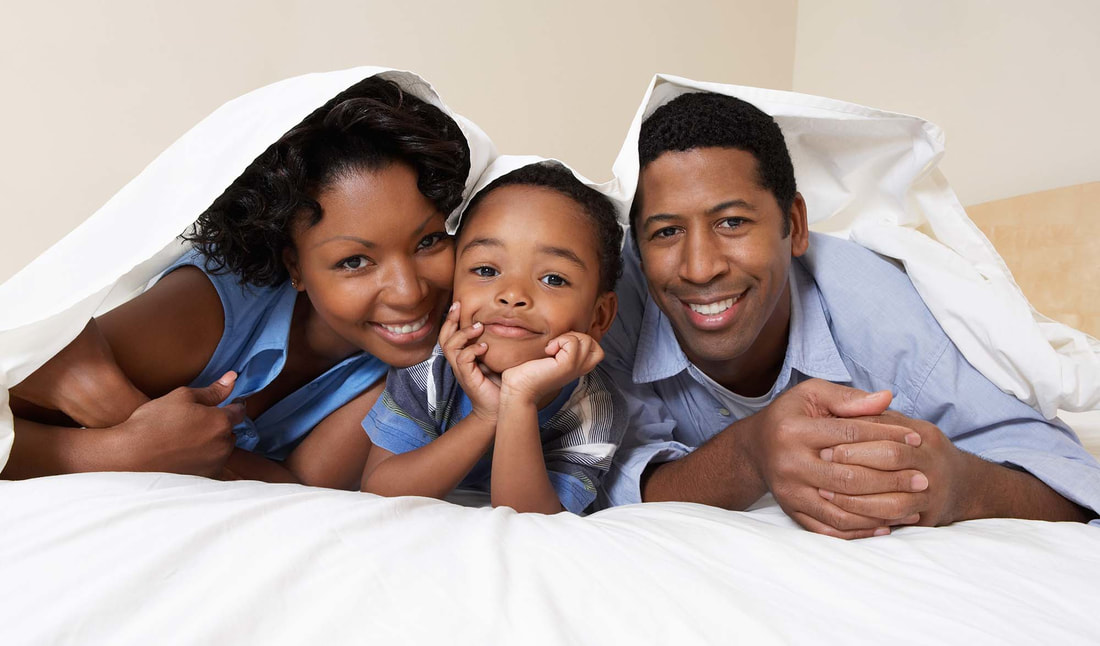 Smiling African American family - Independent Insurance Agency in Garden City, NY